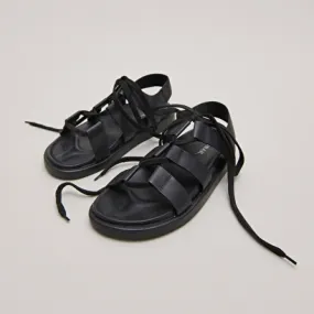 Sandals with multiple straps and laces in black leather