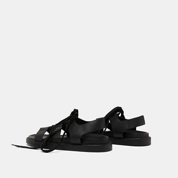 Sandals with multiple straps and laces in black leather